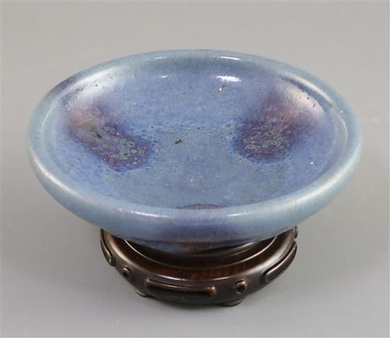 A Chinese Jun type purple-splashed dish, Qing dynasty, D. 12.5cm, wood stand, boxed